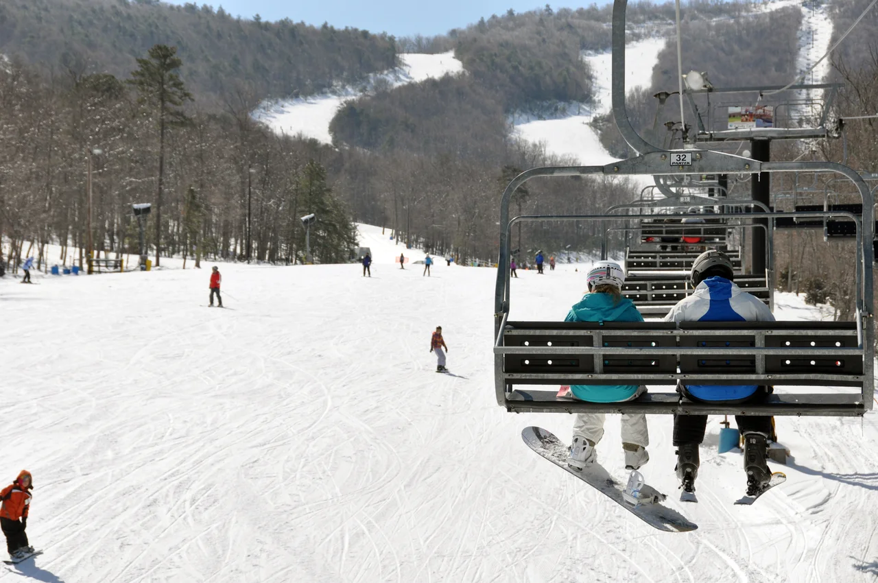 Massanutten scenic winter ski chairlift and skiers 19