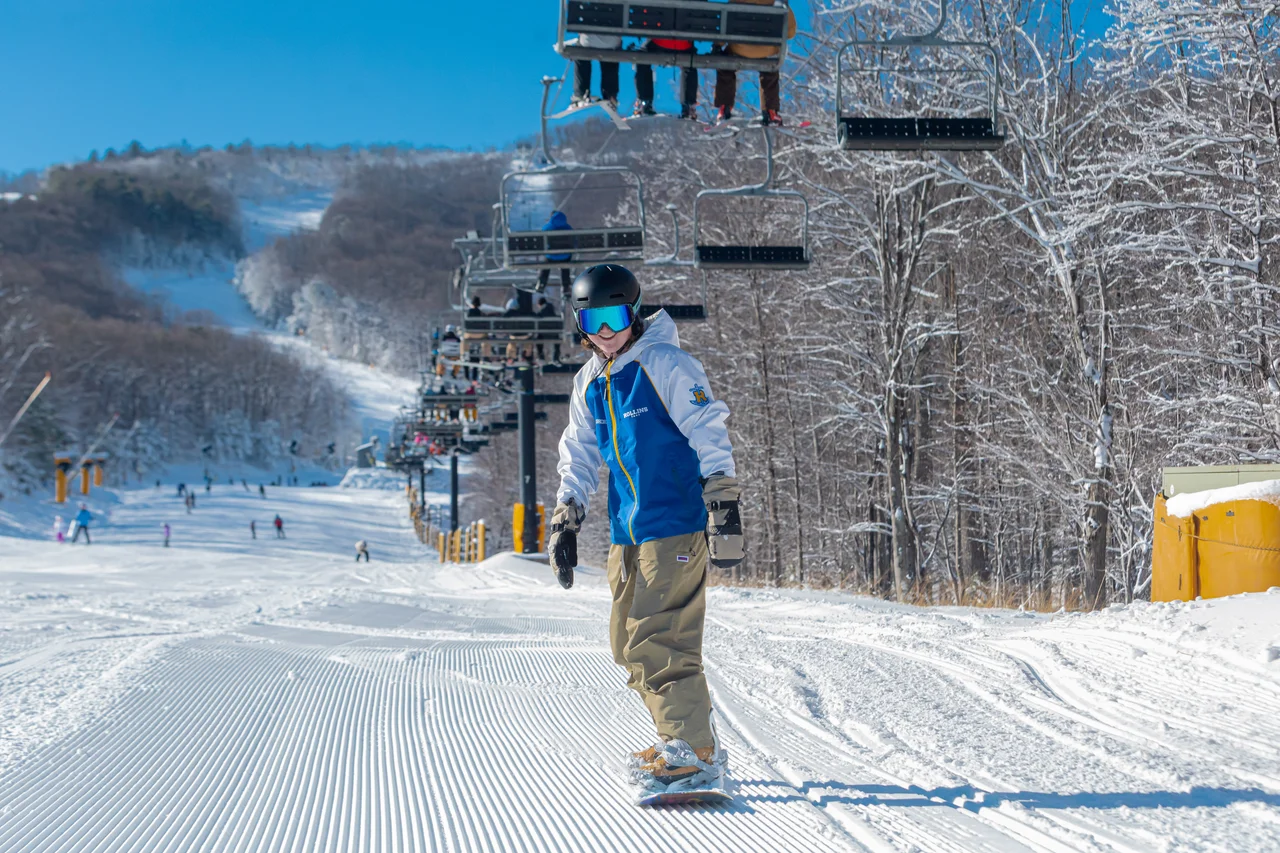 Massanutten ski area general snowboarder below chairlift 18