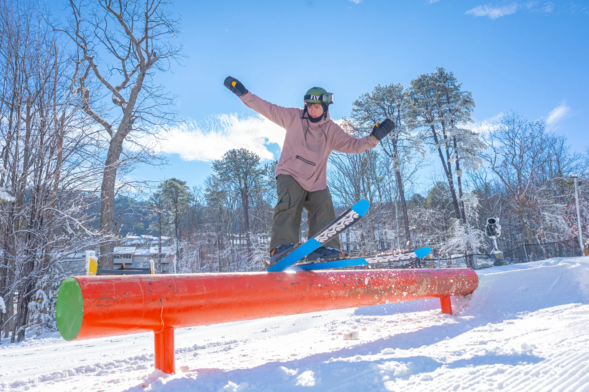 Massanutten ski area terrain park terrain park skier jumping orange rail 02