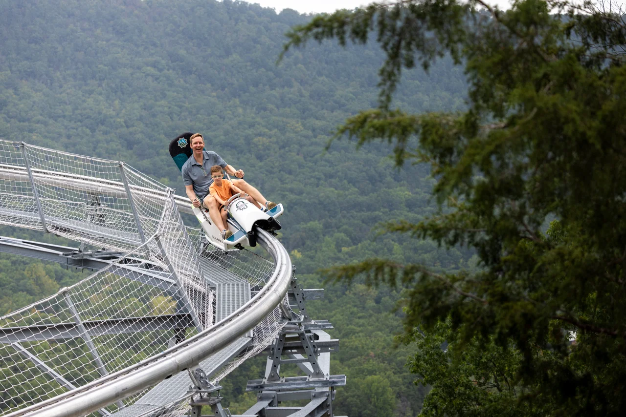 Massanutten mountain mayhem coaster man girl curving track wide