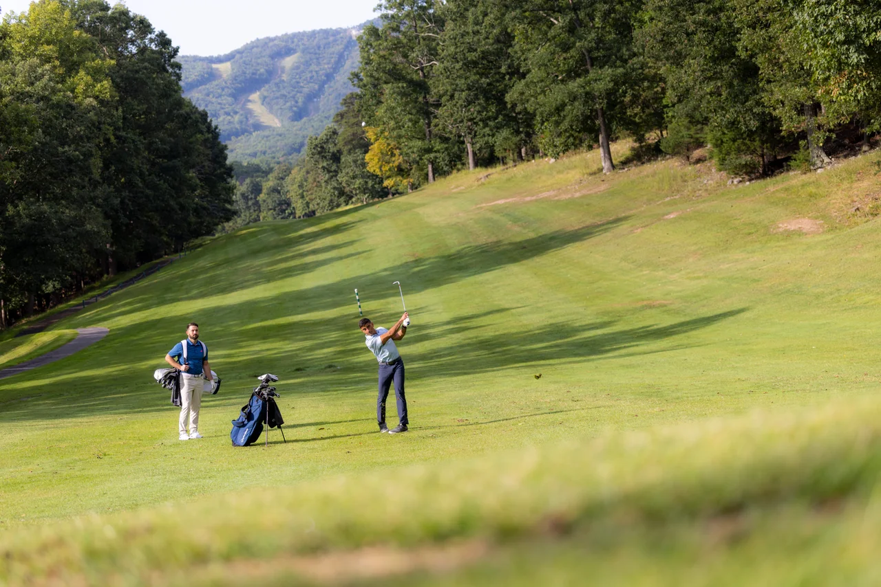 Massanutten mountain greens golfer follow through companion mountain course