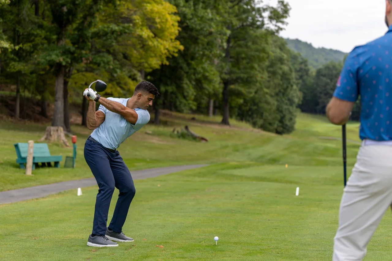 Massanutten mountain greens golfer tee shot swing wooded course