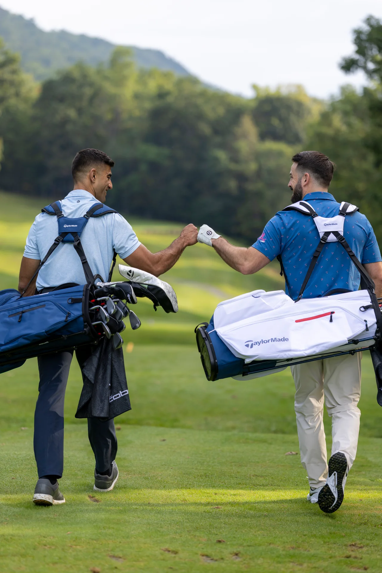 Massanutten mountain greens golfers fist bump golf bags portrait