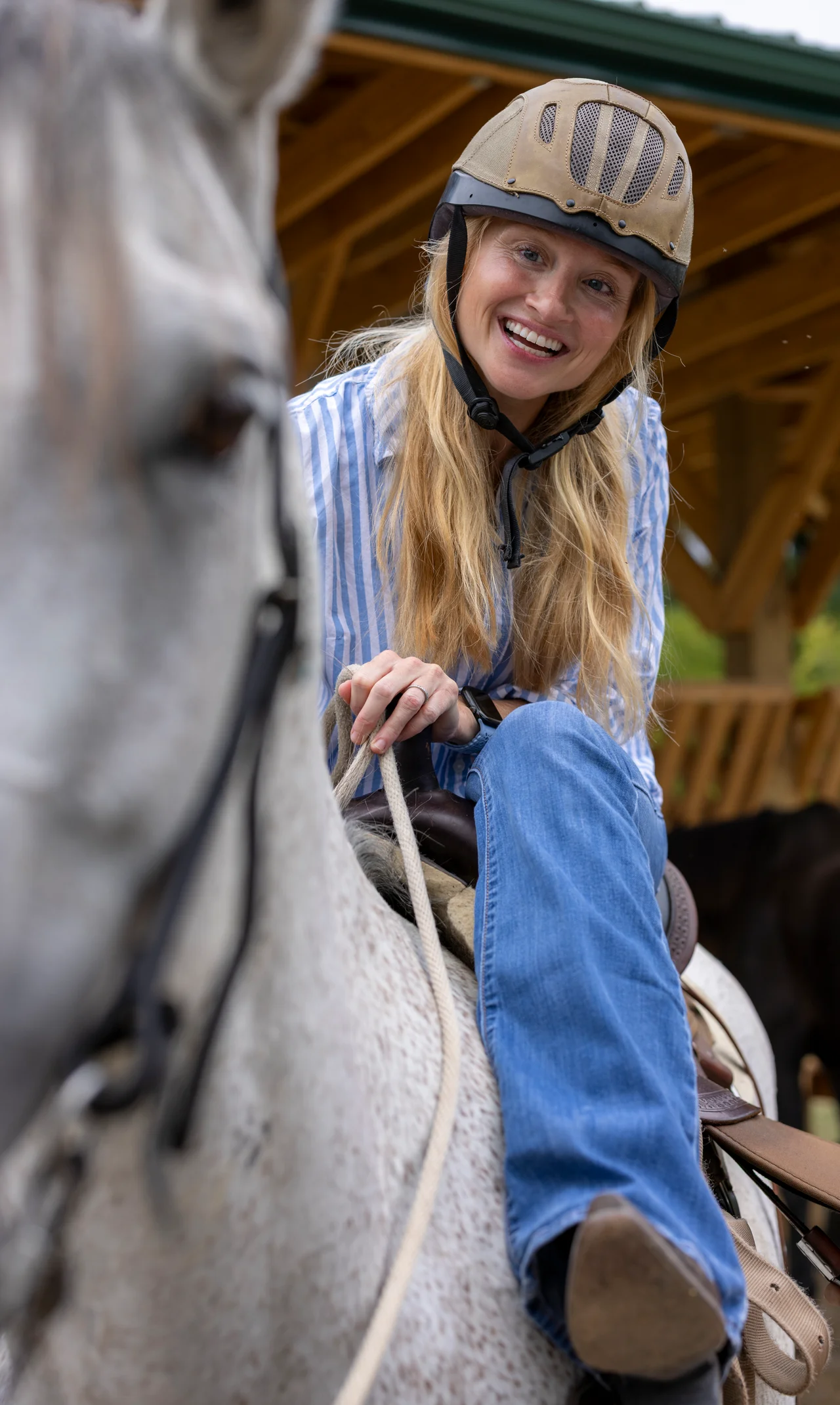 Massanutten horseback riding smiling woman riding gray horse portrait