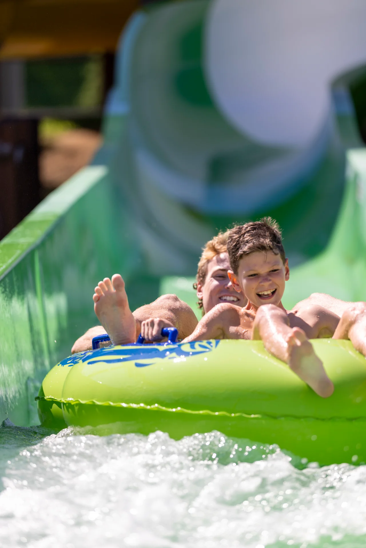 Massanutten outdoor waterpark peak plunge smiling riders green tube splash