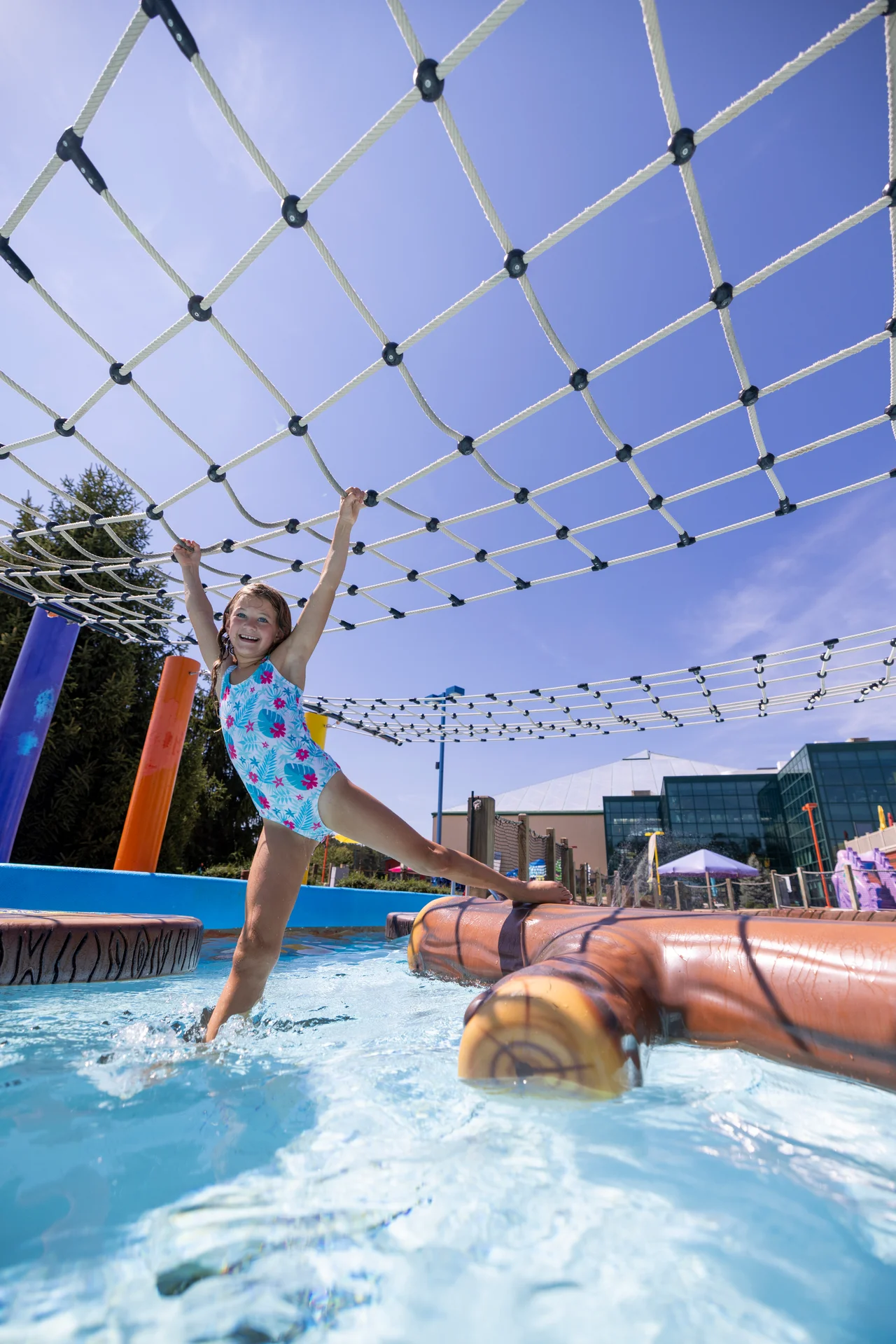 Massanutten outdoor waterpark splash a nutten girl stepping between floating logs