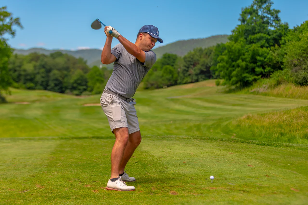 Massanutten woodstone golfer swinging mountain view