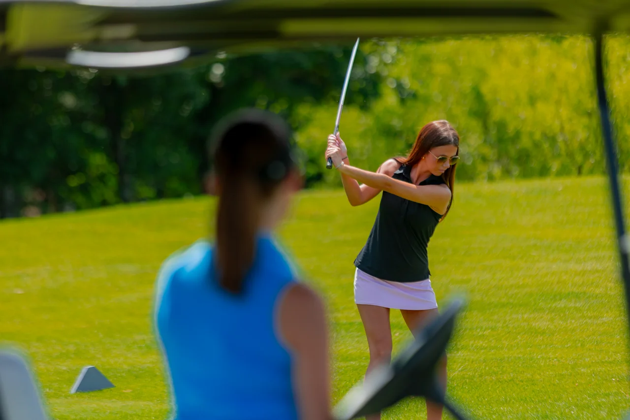 Massanutten woodstone woman golfer swinging
