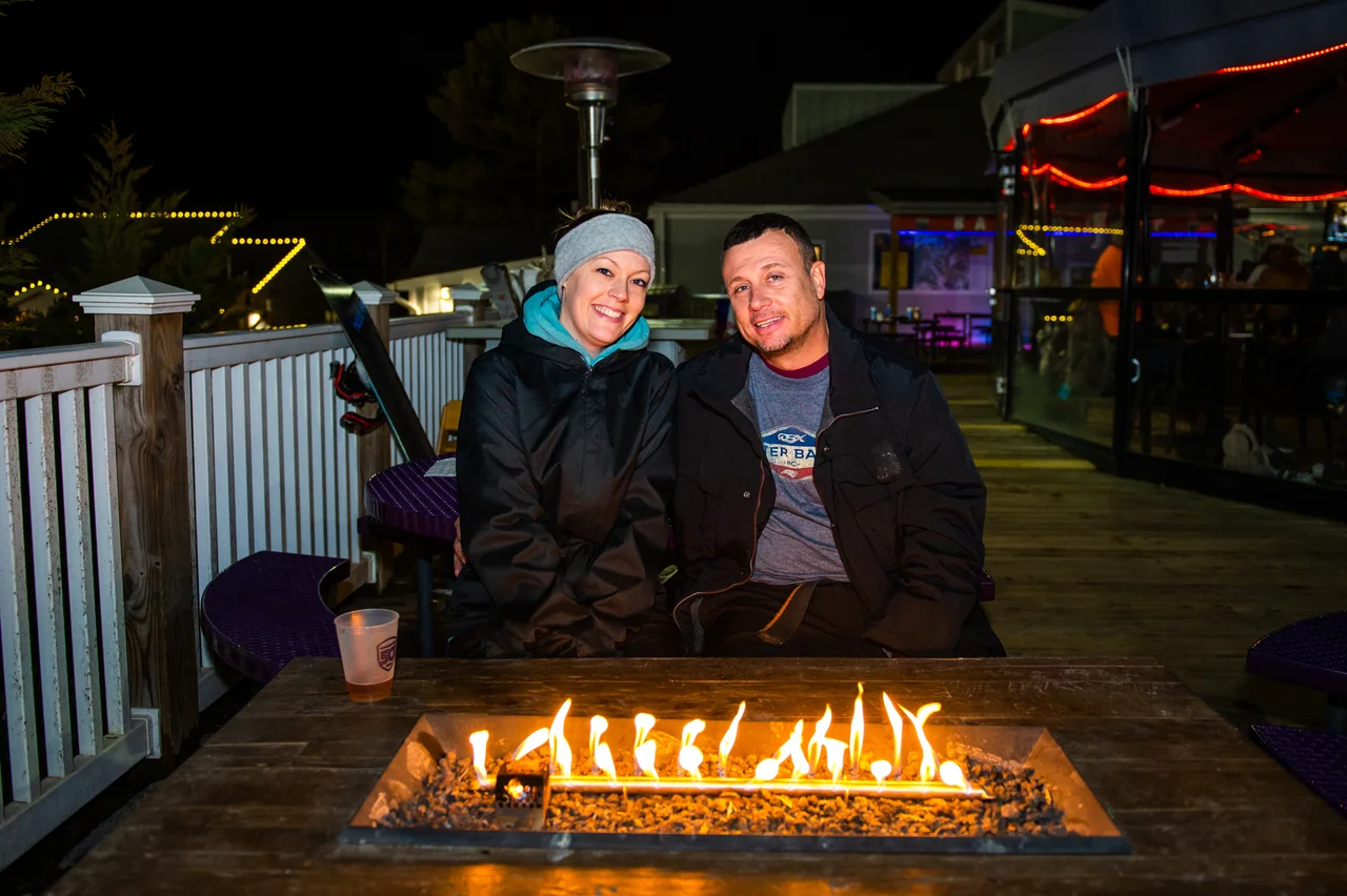 Massanutten base camp fire table outdoor dining couple