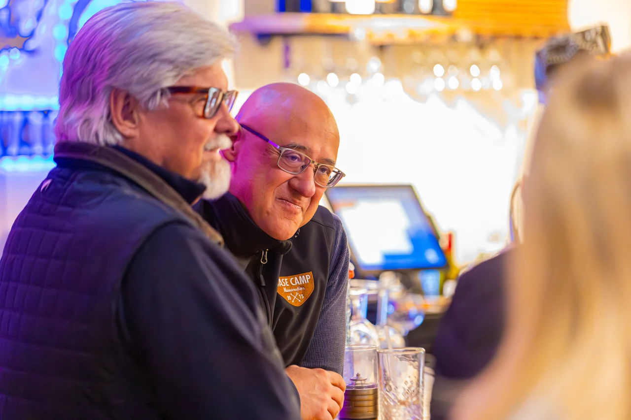Massanutten elevations lounge guests at bar conversation