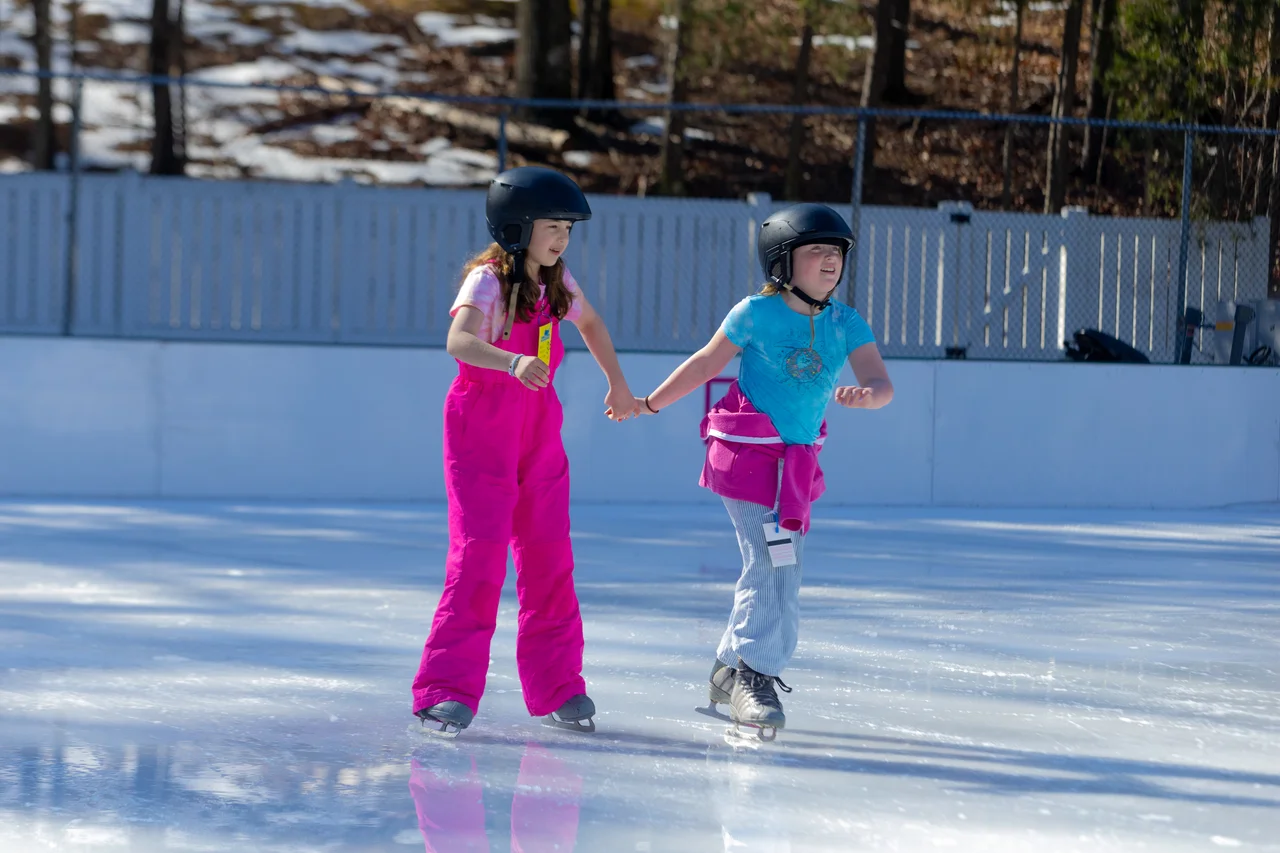 Massanutten ice skating kids holding hands