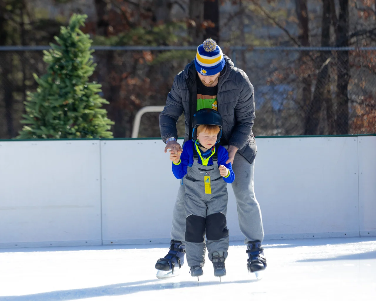 Massanutten ice skating parent helping child