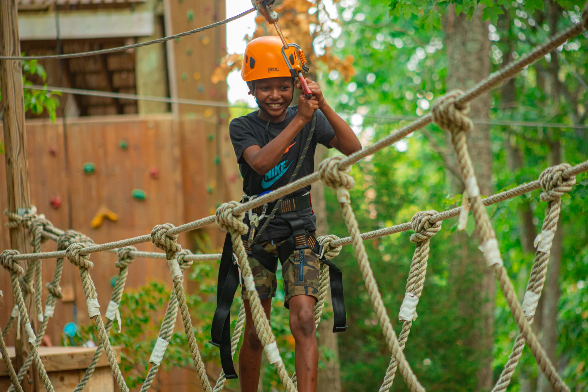 Massanutten kids adventure course boy crossing rope bridge