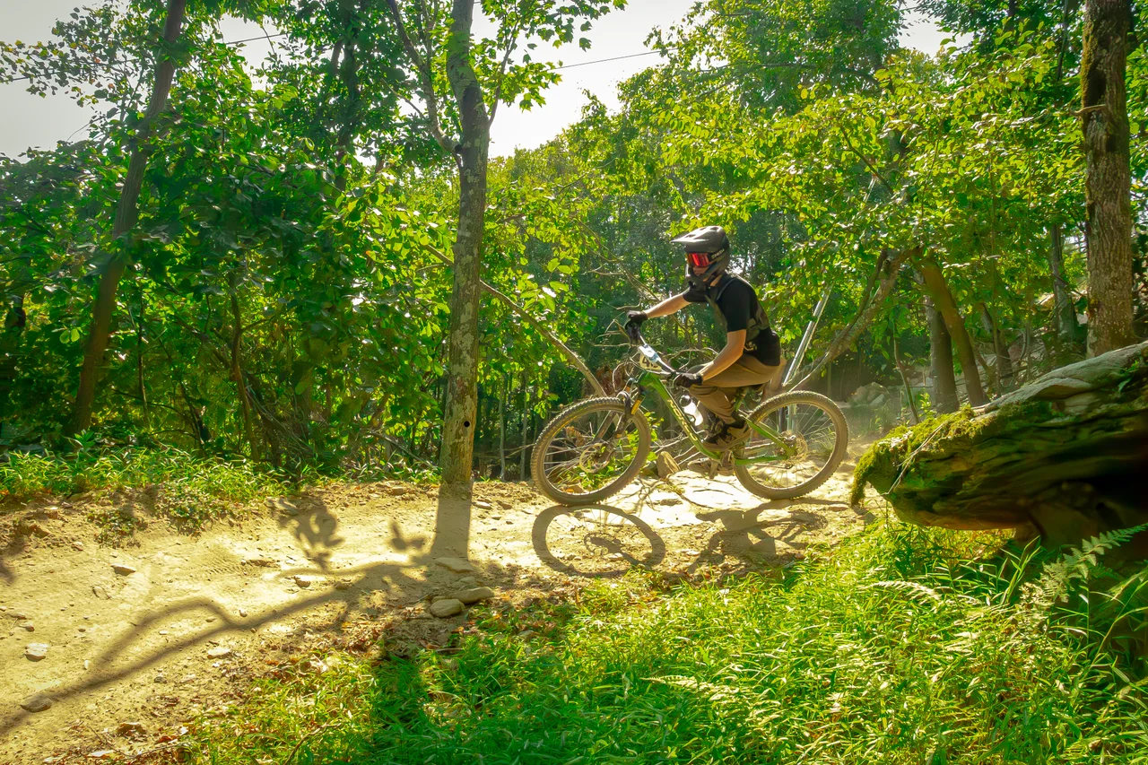 Massanutten mountain biking bike park mountain biker jumping in forest 28