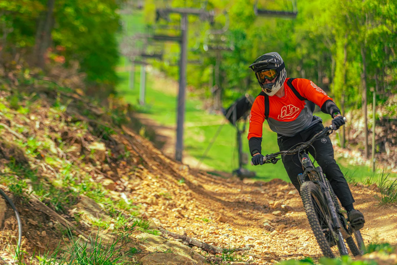 Massanutten mountain biking bike park mountain biker on downhill berm 15