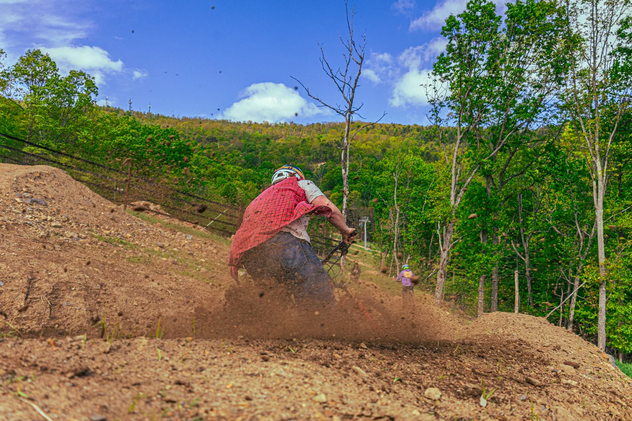 Massanutten mountain biking bike park mountain biker on forest berm 10
