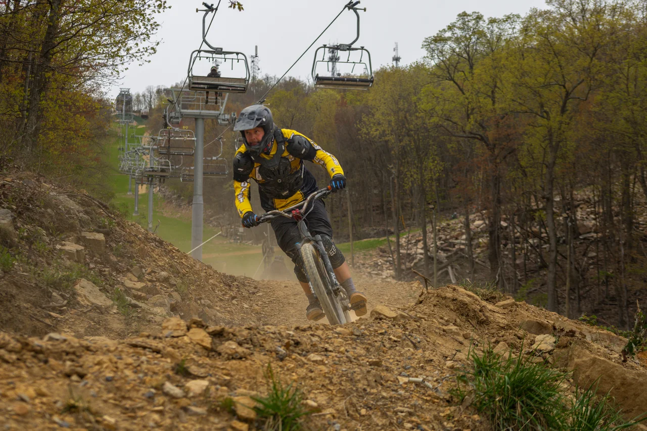 Massanutten mountain biking bike park mountain biker on wooded trail 03