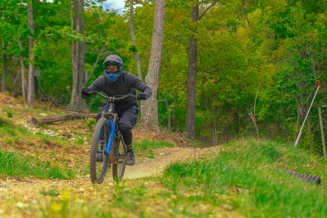 Massanutten mountain biking bike park mountain biker on wooded trail 21
