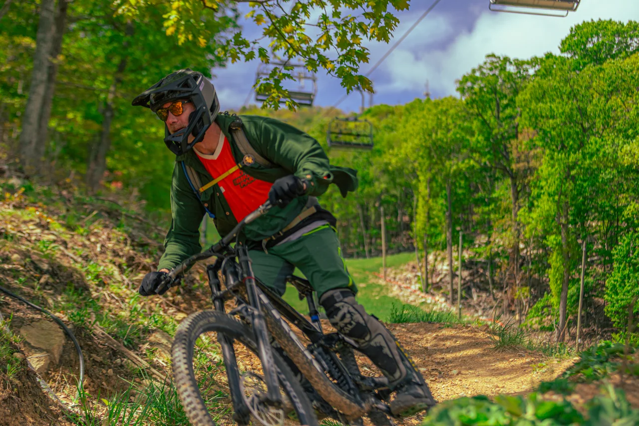 Massanutten mountain biking bike park mountain bikers riding chairlift 17