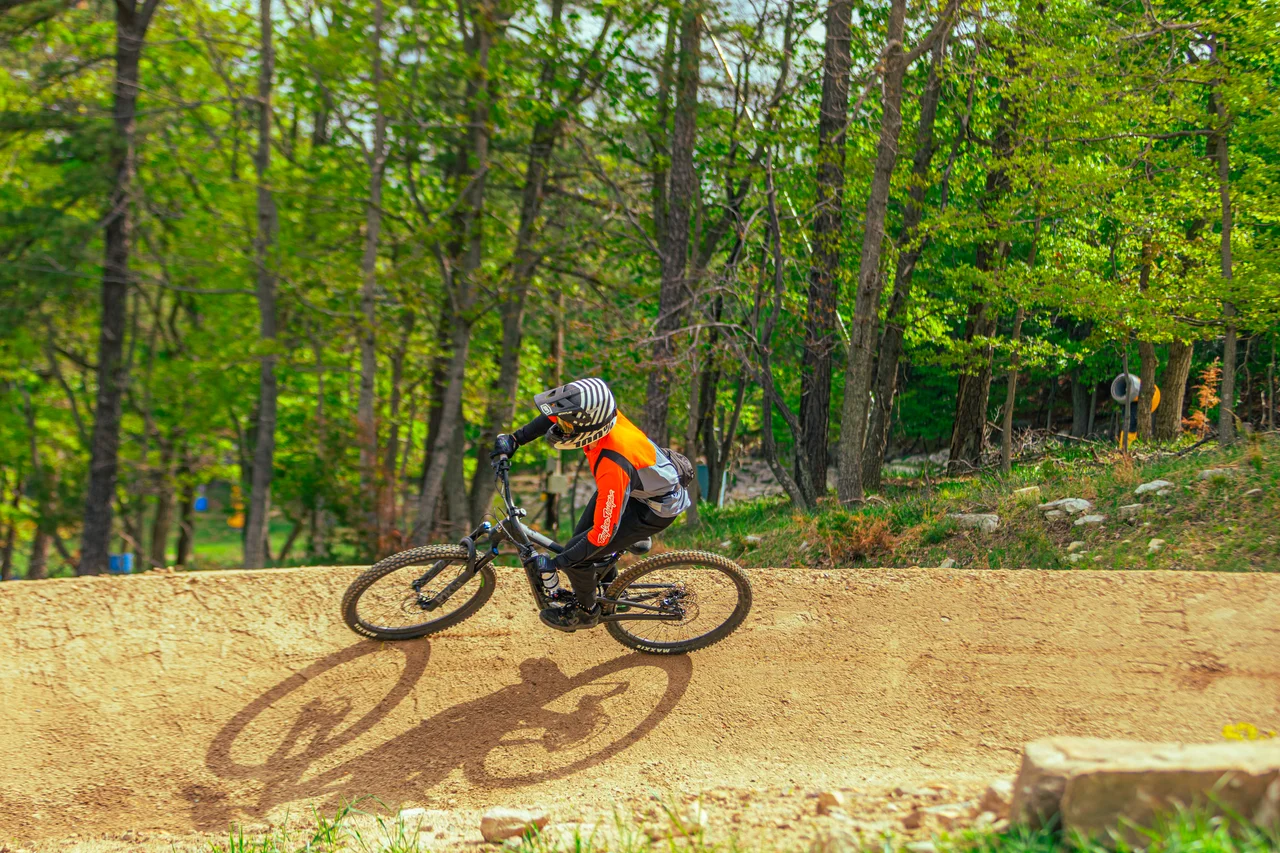 Massanutten mountain biking bike park two mountain bikers on chairlift trail 07