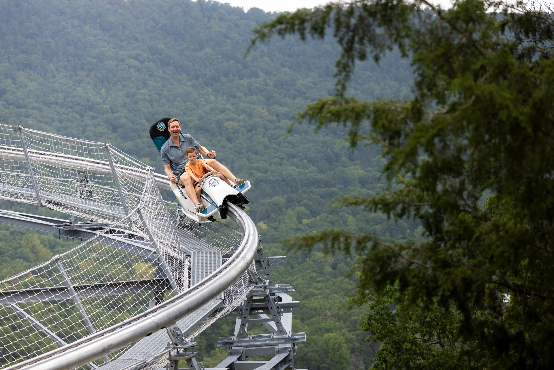Massanutten mountain mayhem coaster man girl curving track wide