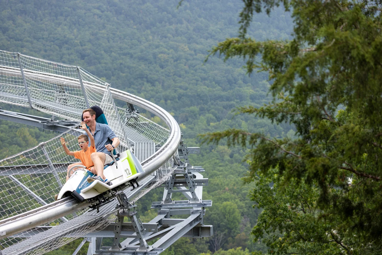 Massanutten mountain mayhem coaster man girl track forest wide