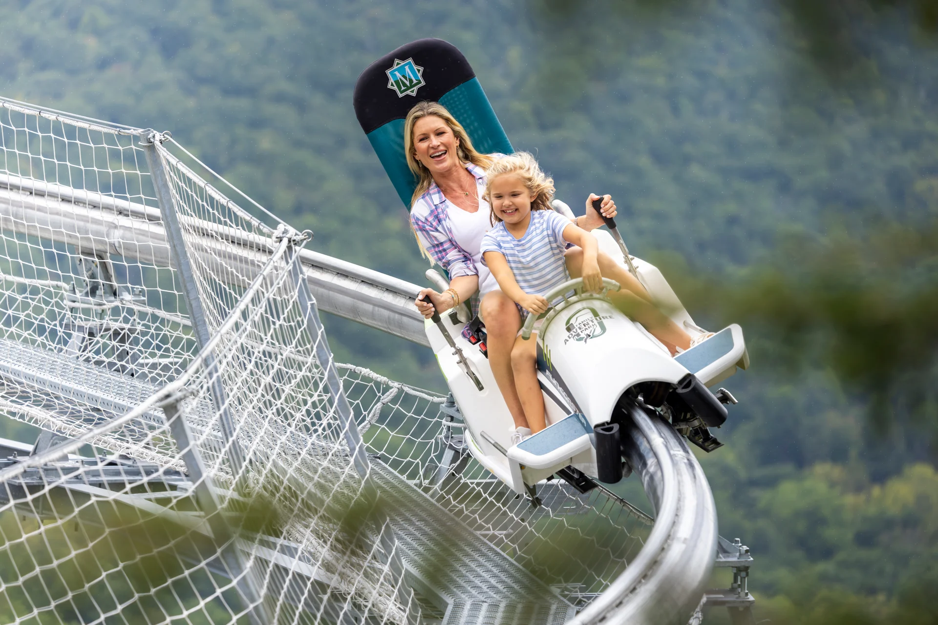 Massanutten mountain mayhem coaster smiling woman girl turn