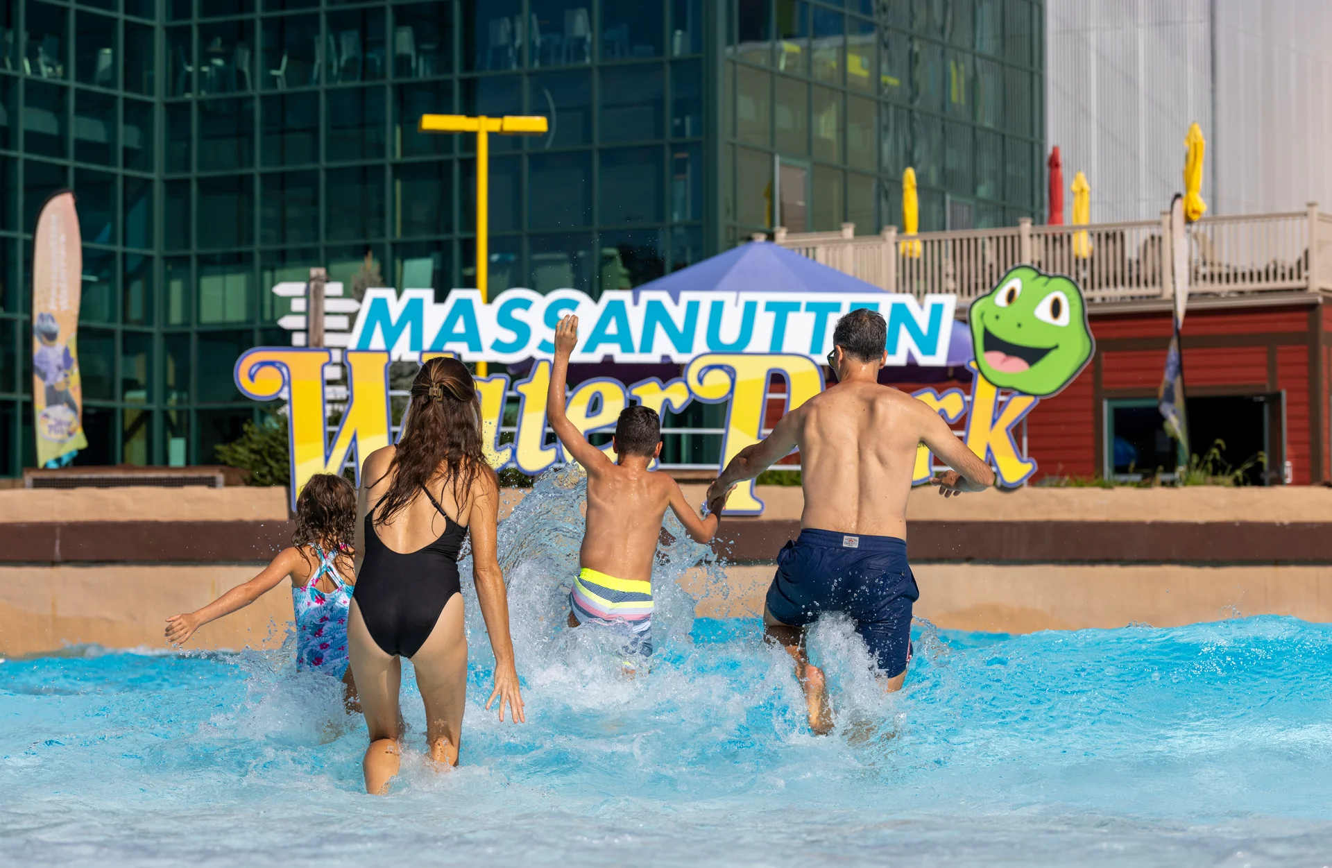 Massanutten outdoor waterpark white caps family walking into wave pool