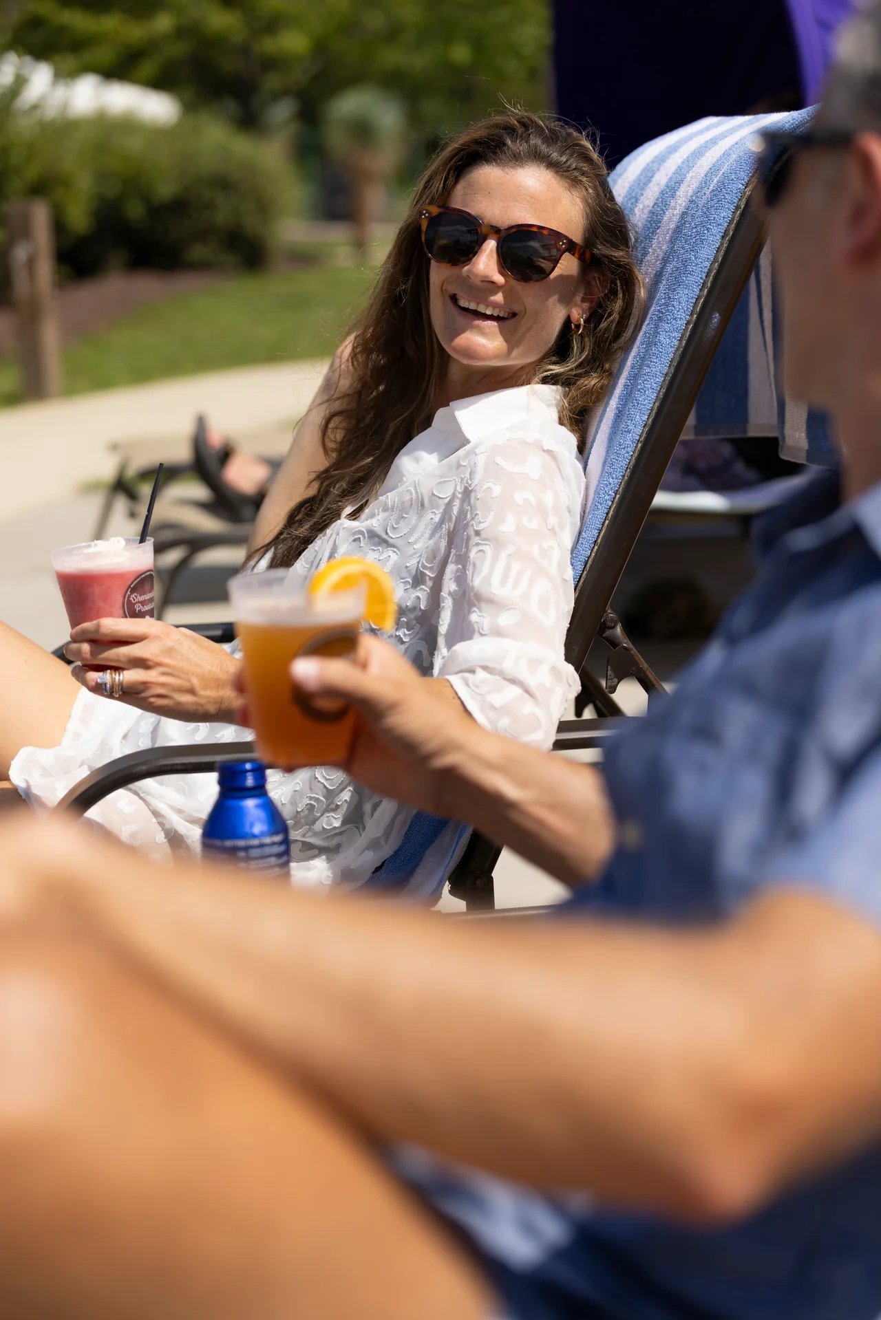 Massanutten outdoor waterpark woman drink lounge chair