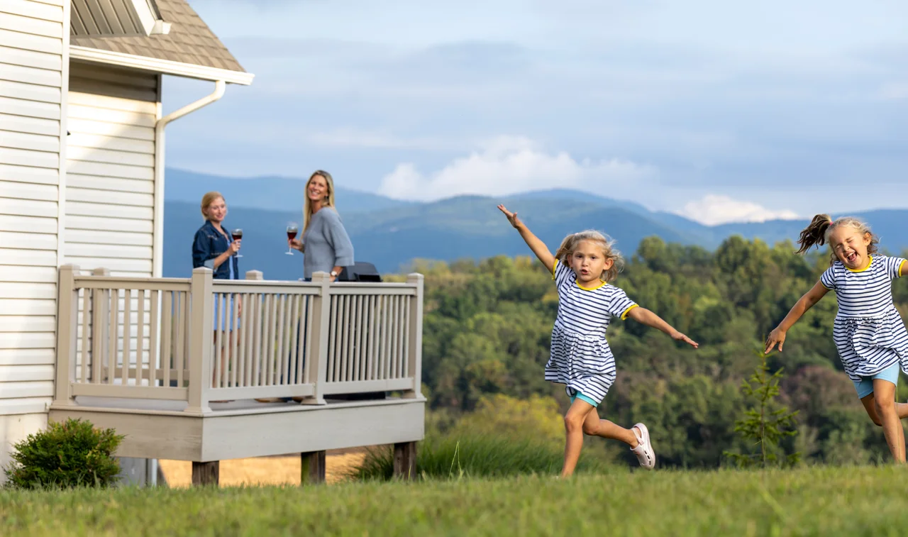 Massanutten regal vista two girls running resort lawn mountain view