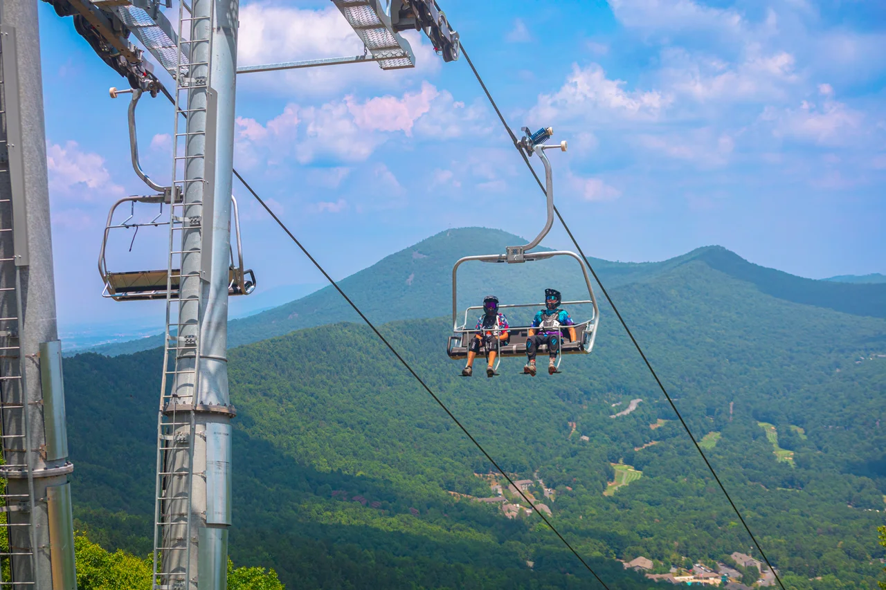 Massanutten scenic chairlift spring summer mountain bikers on chairlift 01