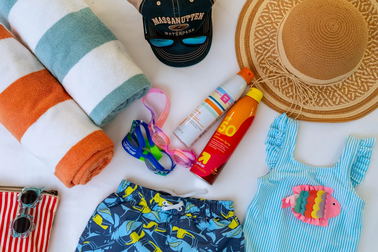 Massanutten shenandoah h2o waterpark flat lay towels cap sunscreen goggles 004