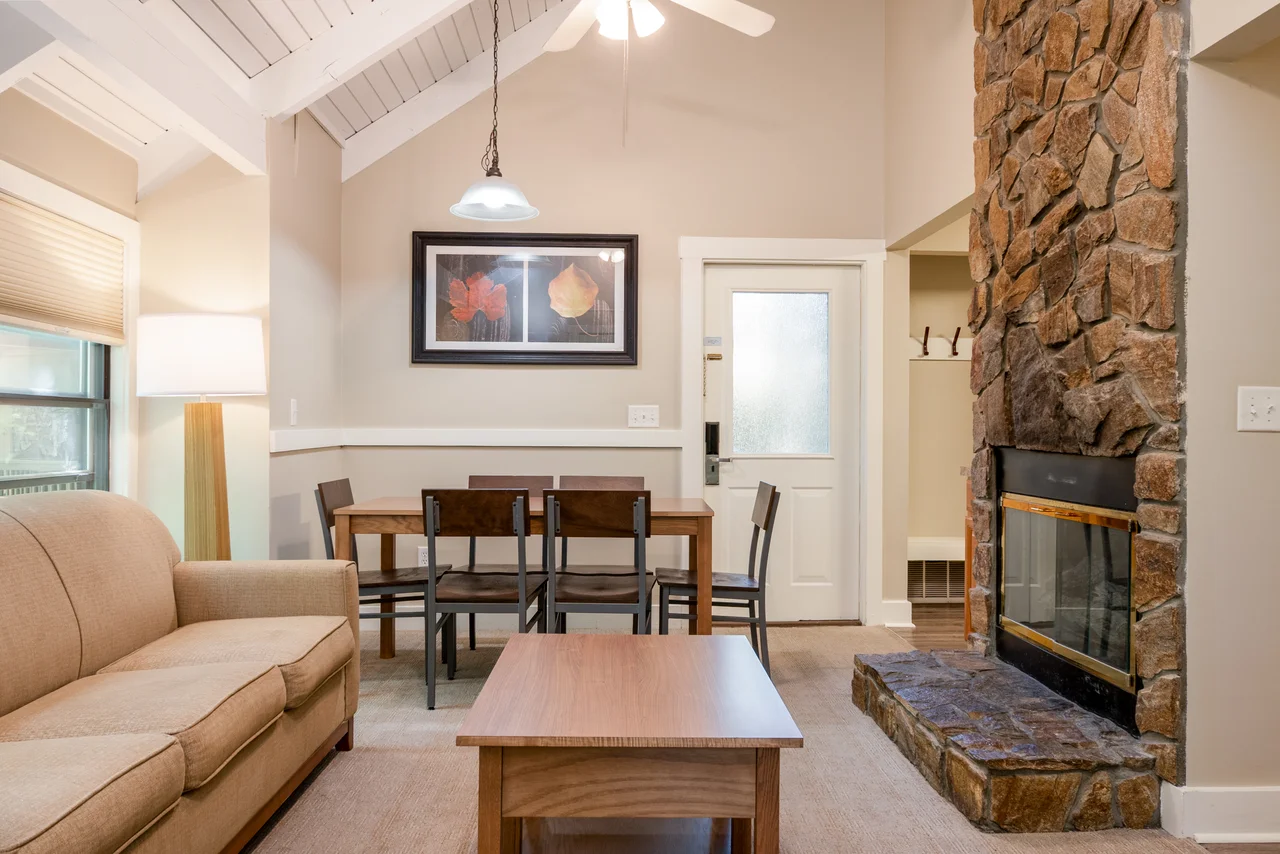 Massanutten shenandoah villas 9a living room dining stone fireplace 01