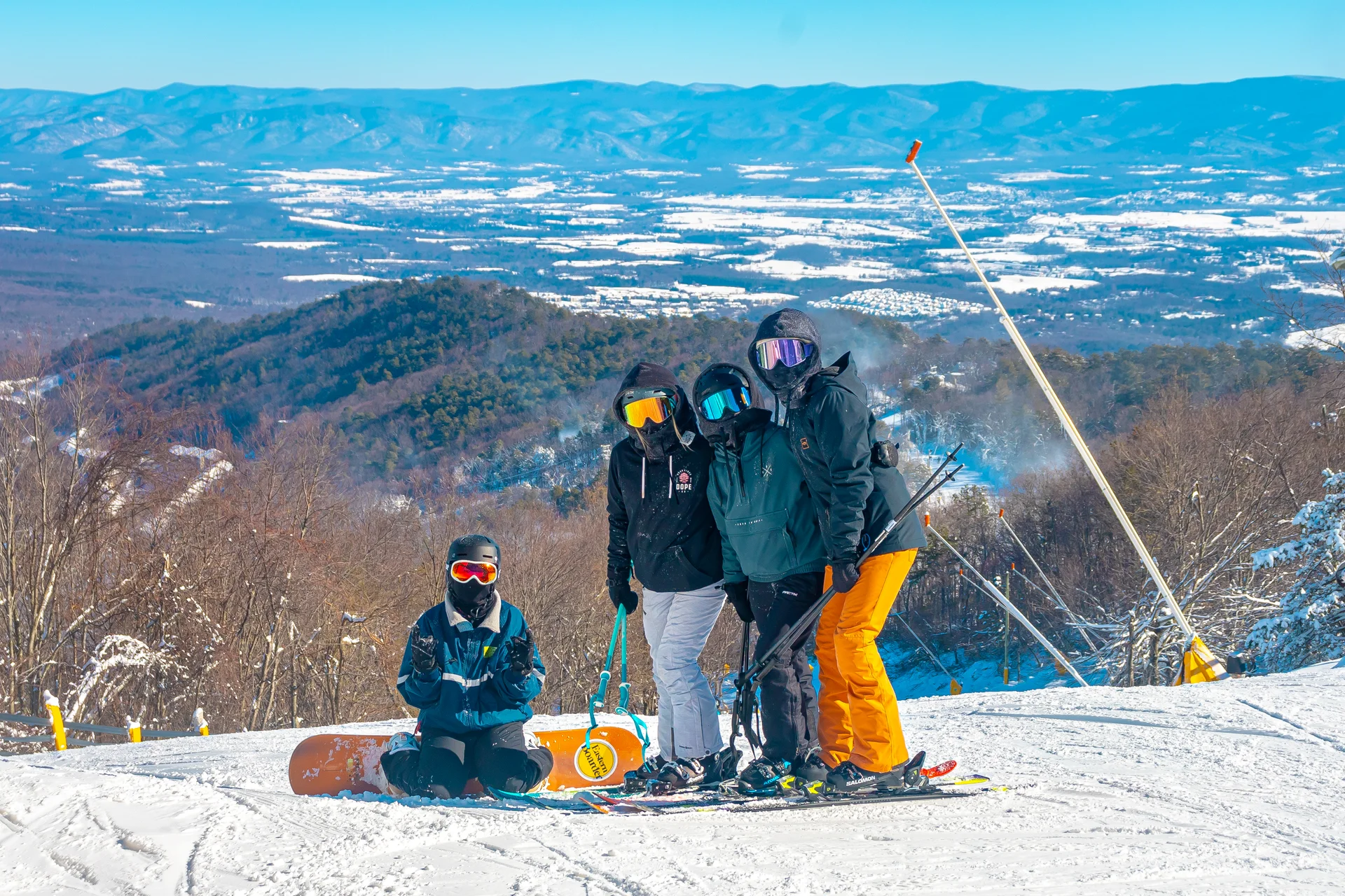 Massanutten ski area general skiers on snowy slope valley view 06