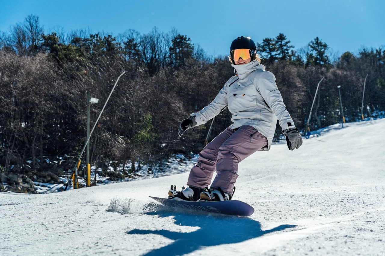 Massanutten ski area general snowboarder carving snowy slope 14