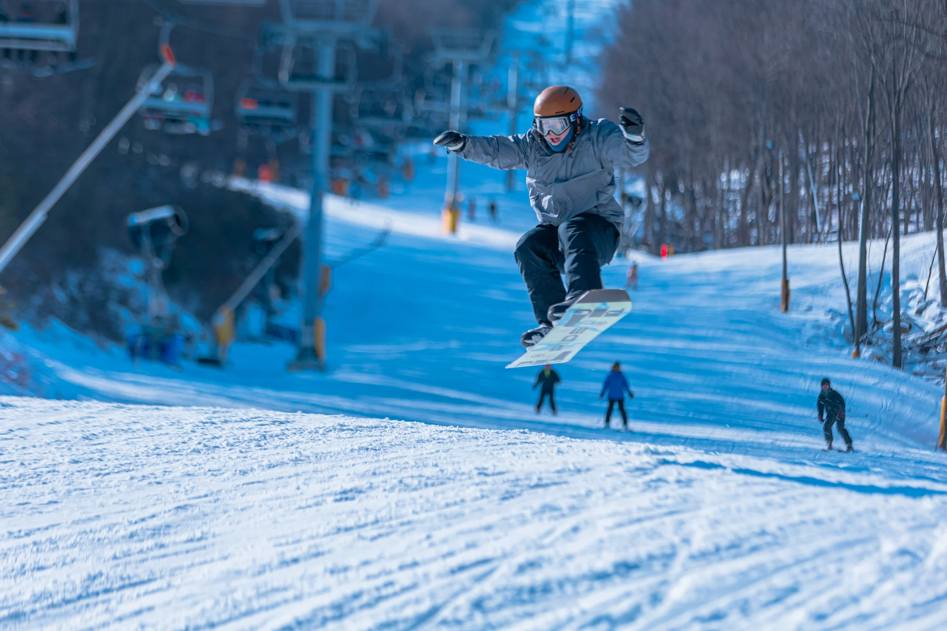 Massanutten ski area general snowboarder jump on ski slope 22