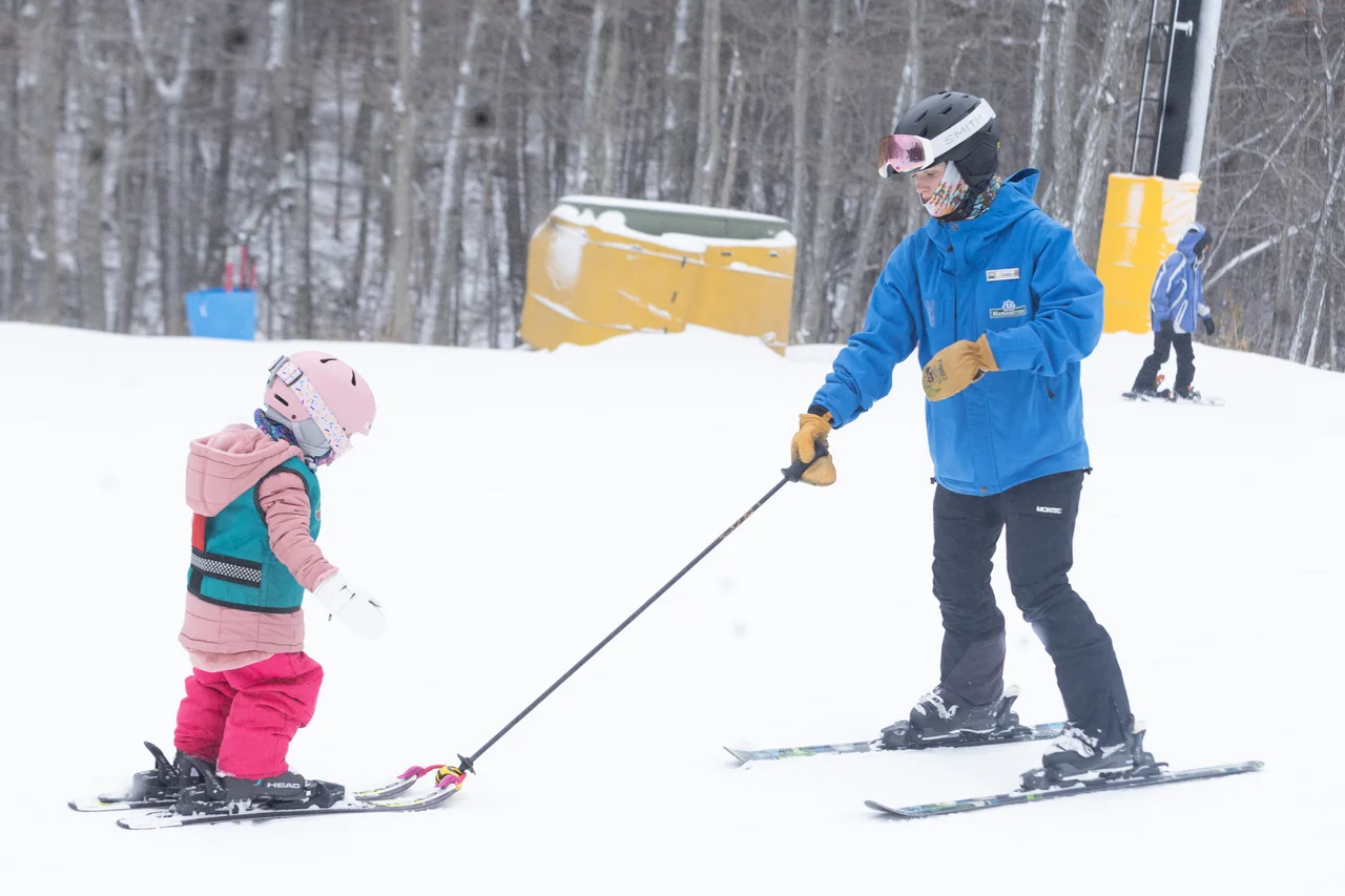 Massanutten ski area lessons ski lesson instructor and child 07