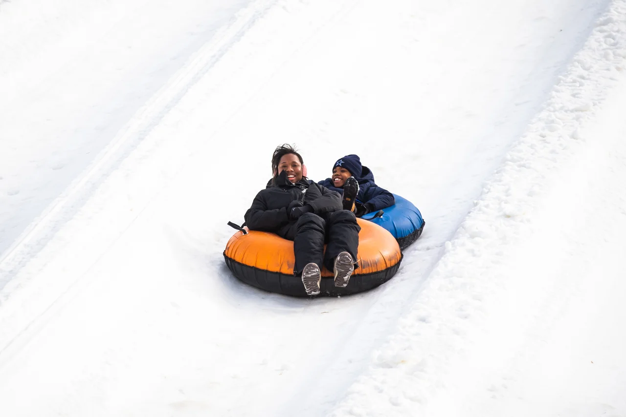 Massanutten snow tubing day family riding tubes