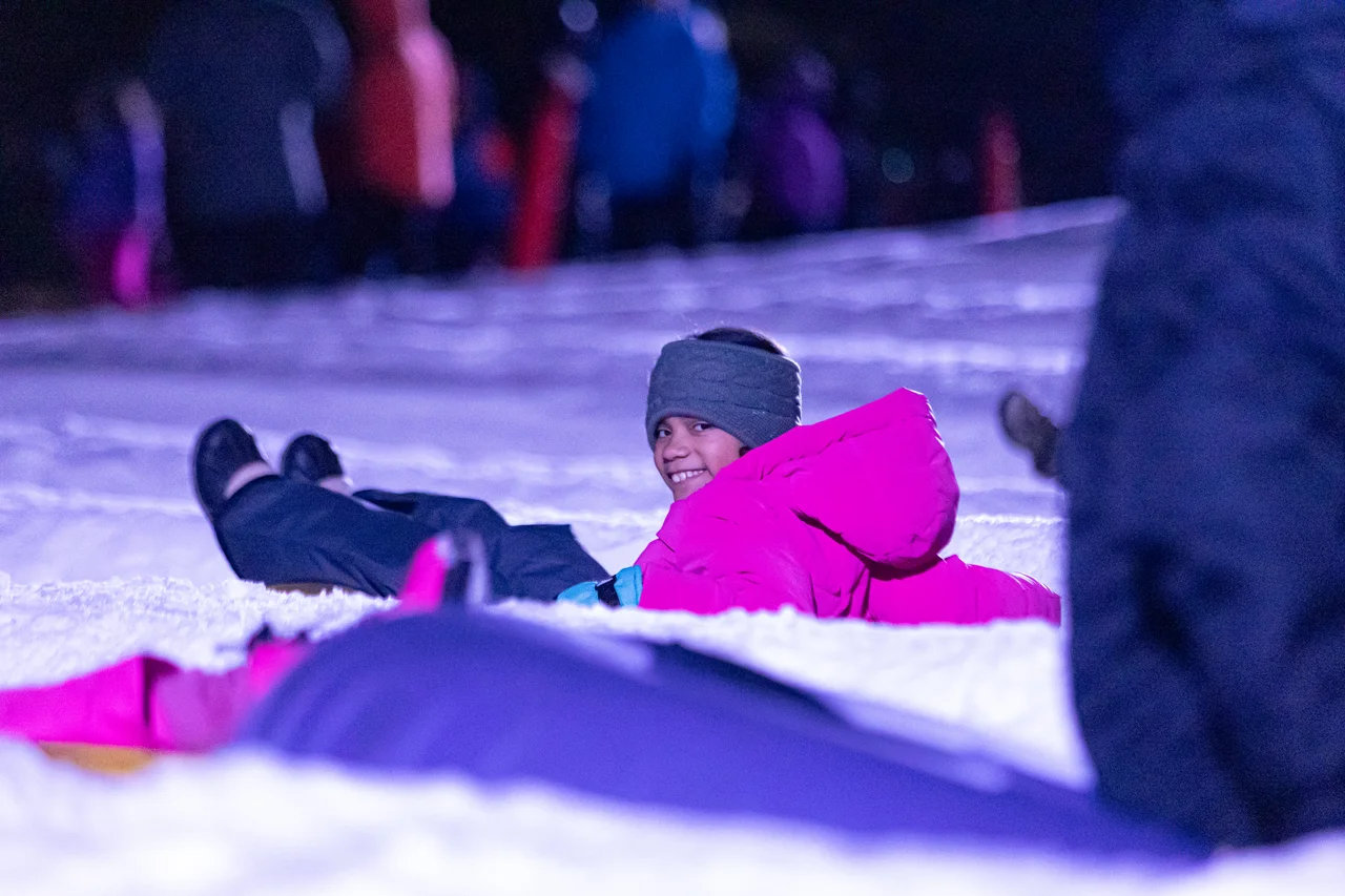 Massanutten snow tubing night child on tube