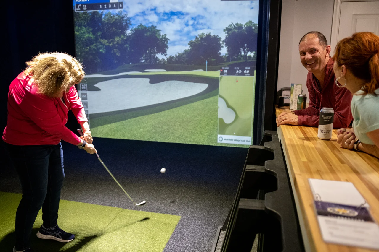 Massanutten topgolf swing suite guest playing golf simulator 07