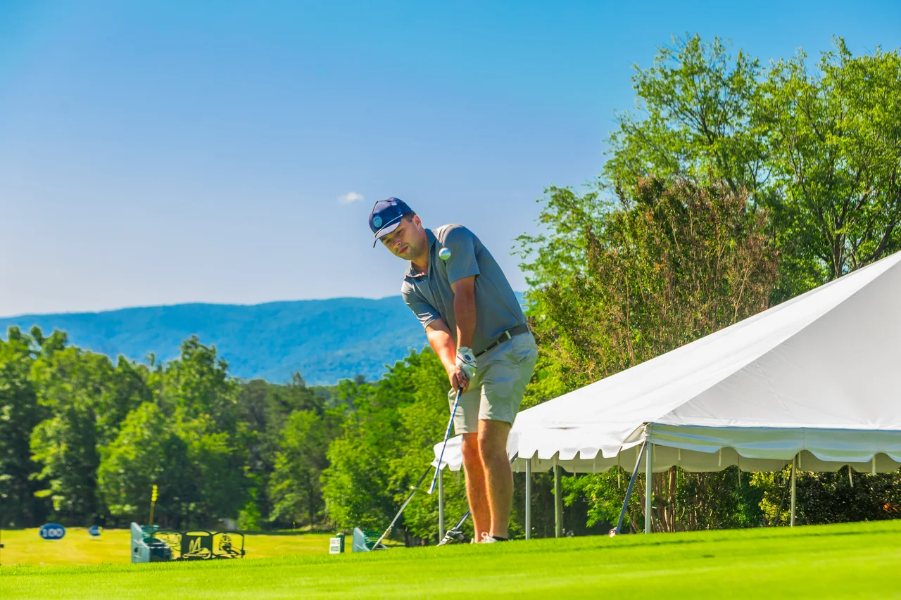 Massanutten woodstone golfer putting near mountain view