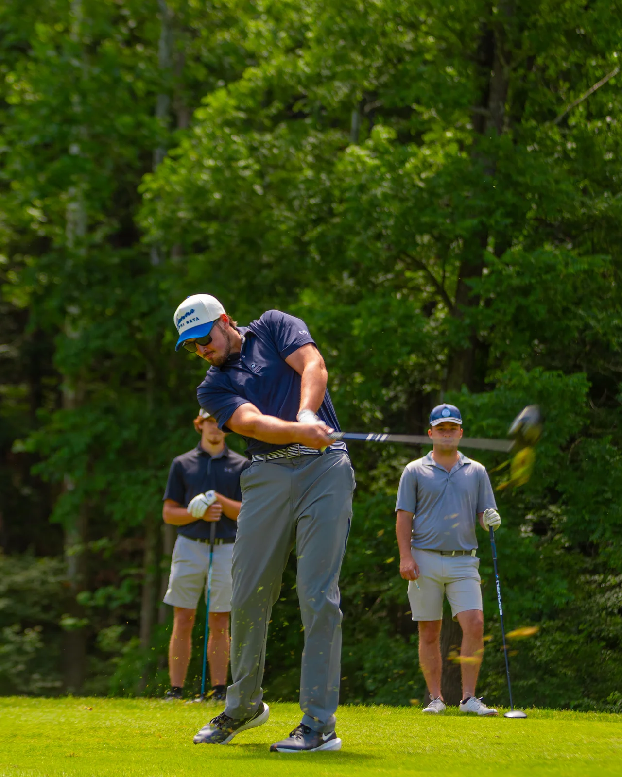 Massanutten woodstone golfer swinging with group
